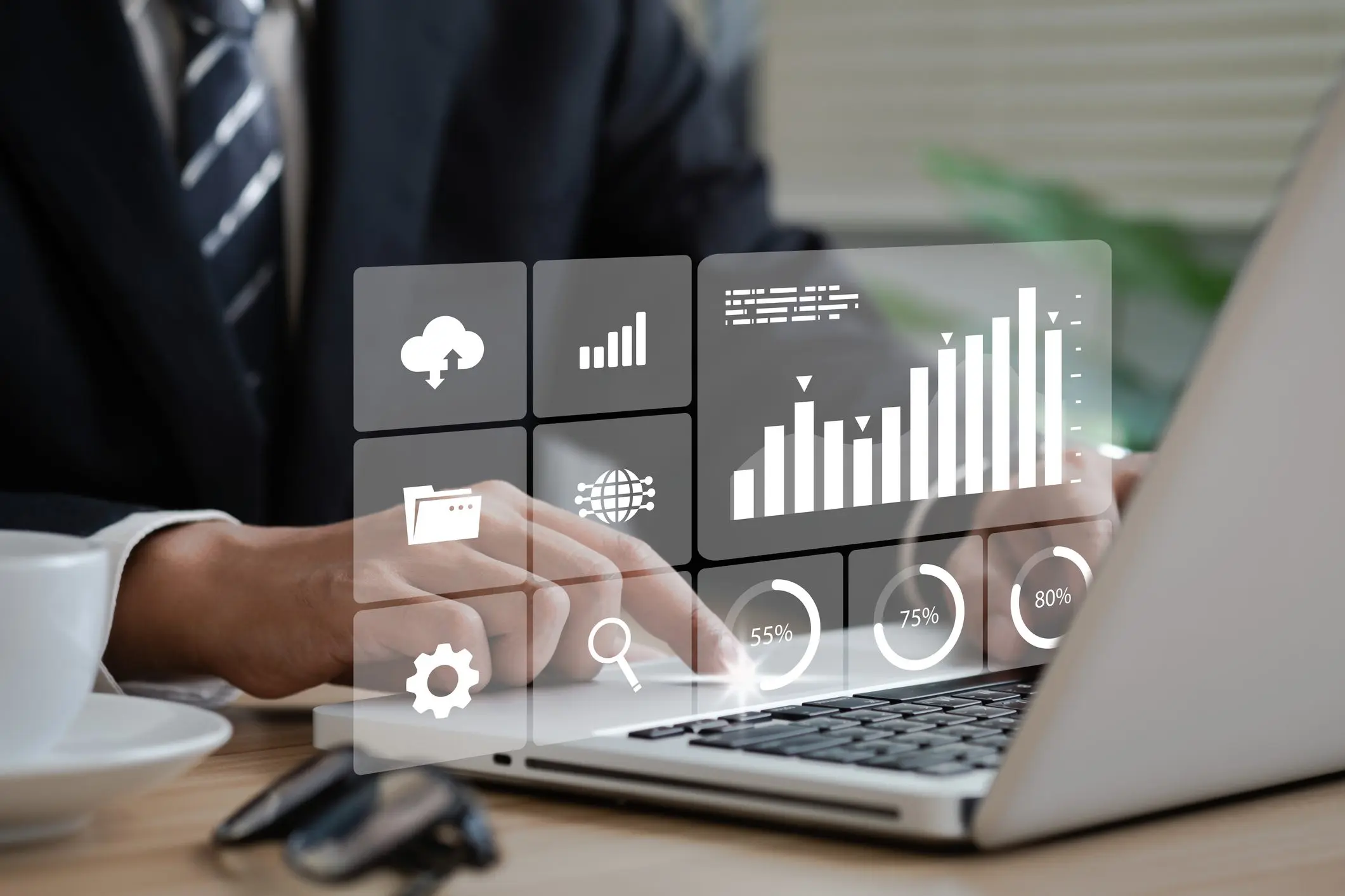 Business analytics dashboard overlay on laptop