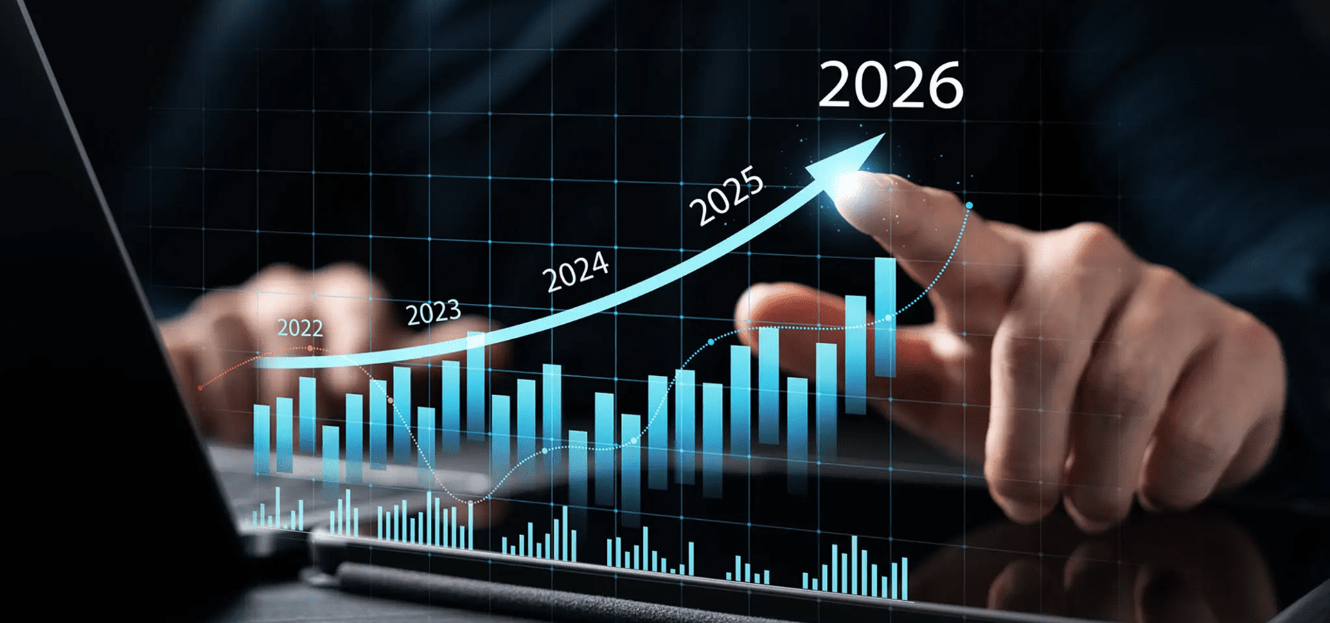 Hand pointing at 2026 upward business growth chart