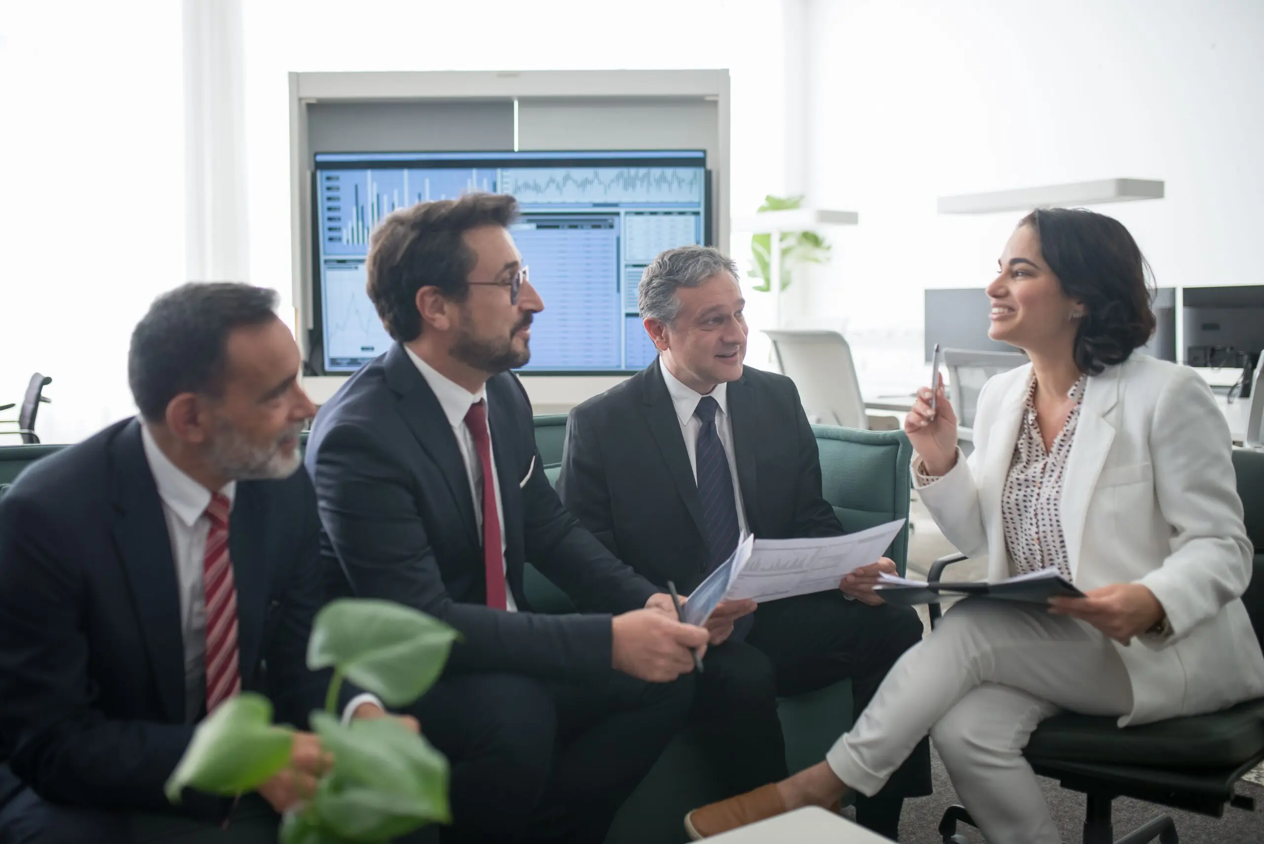 Business team discussing documents in office meeting