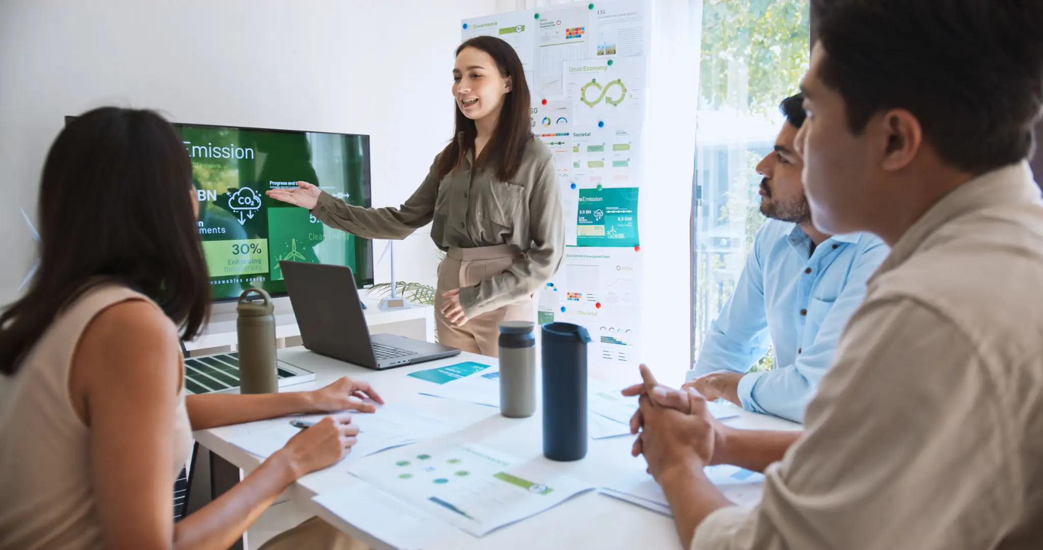 Woman giving presentation to colleagues in meeting