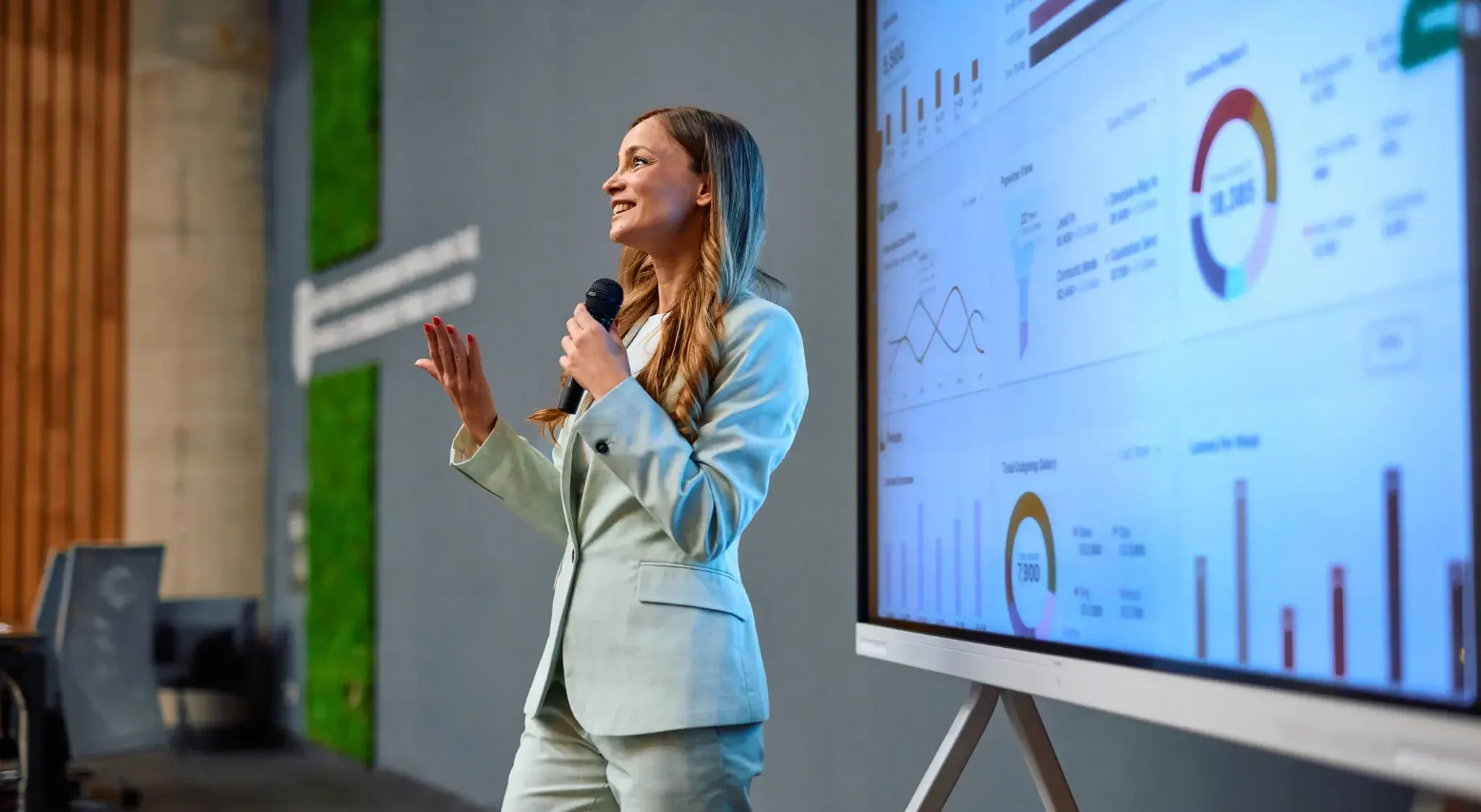 Presenter discussing data insights in a conference.