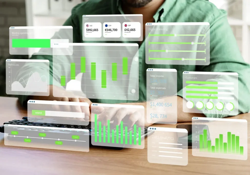 Person using laptop with floating analytics dashboards
